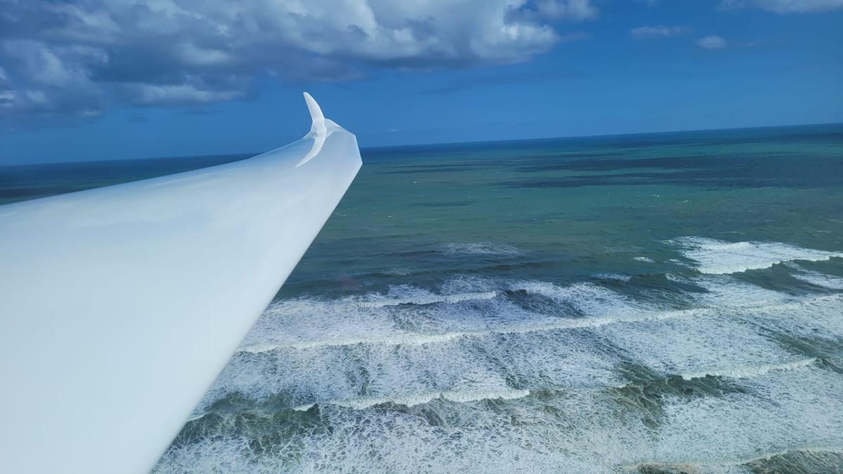 flying over beach glider new zealand